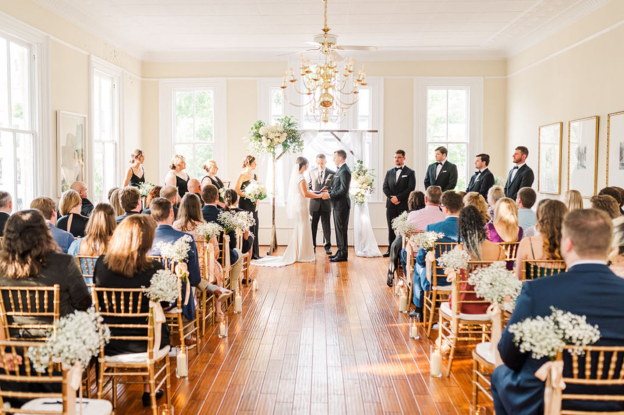 bride and groom exchanging vows at their old town alexandria wedding