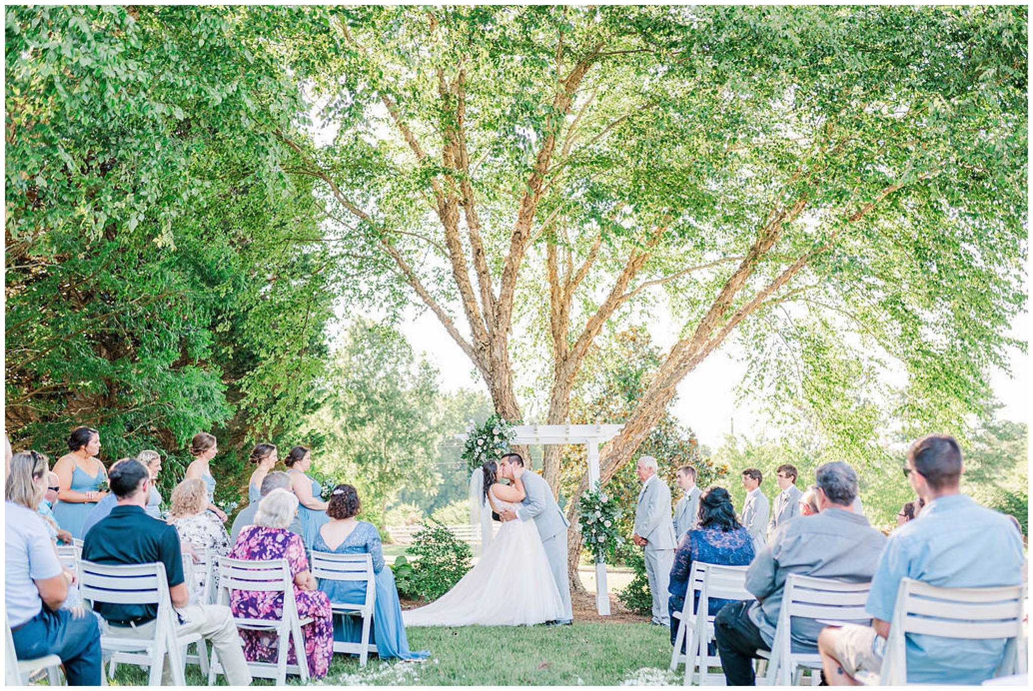 bride and groom's first kiss at wakefield plantation wedding