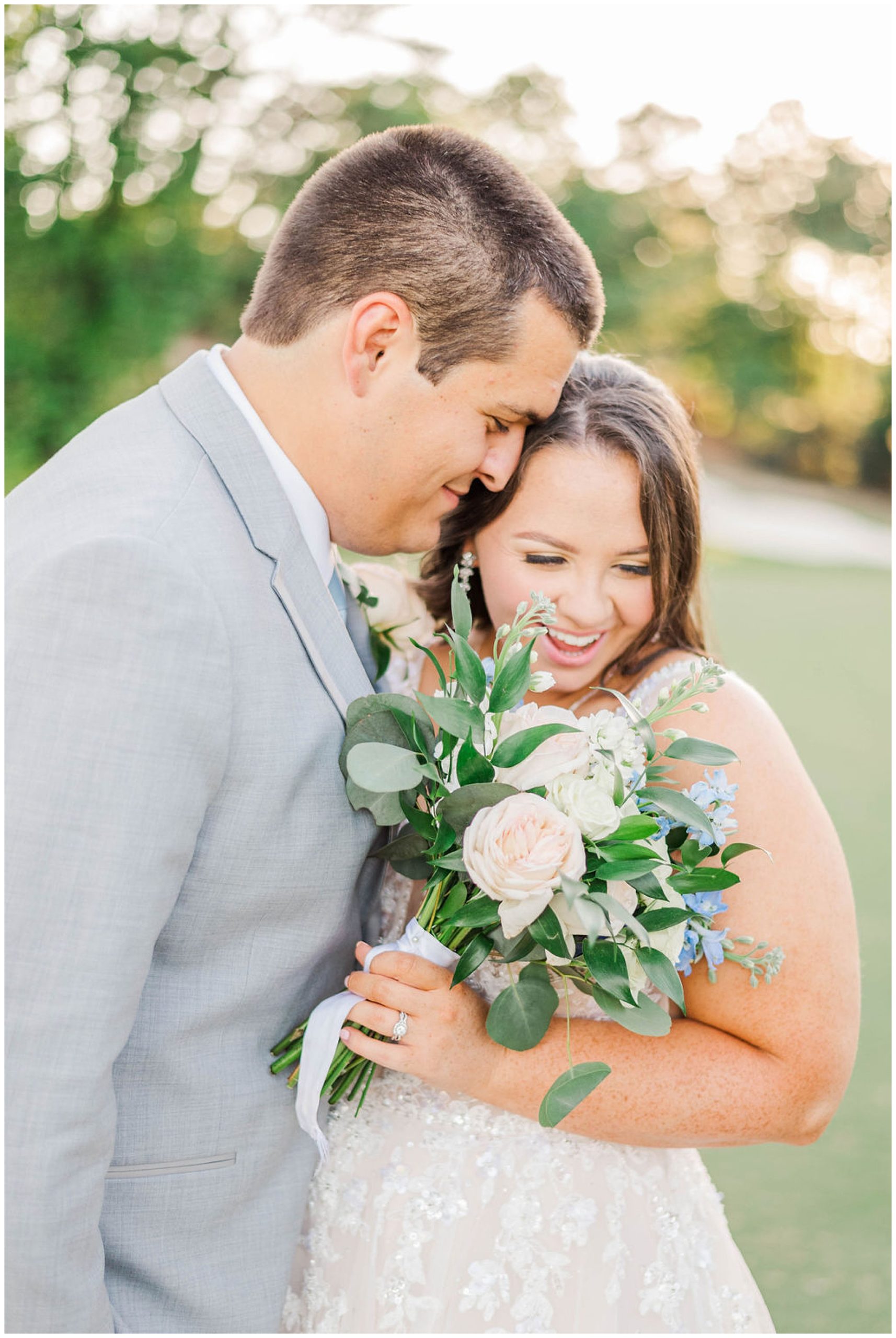 groom and bride laughing and nuzzling at wakefield plantation wedding