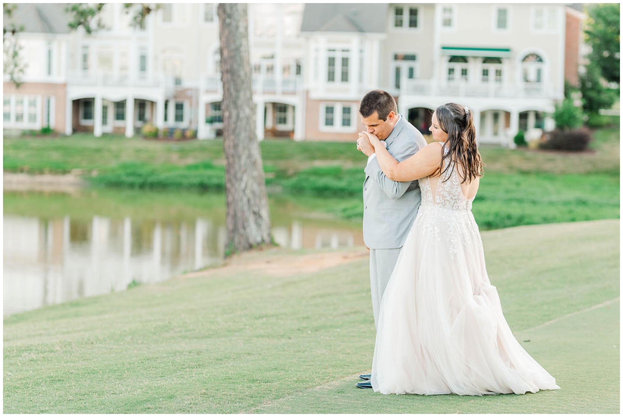 groom kissing his bride's hand at wakefield plantation wedding