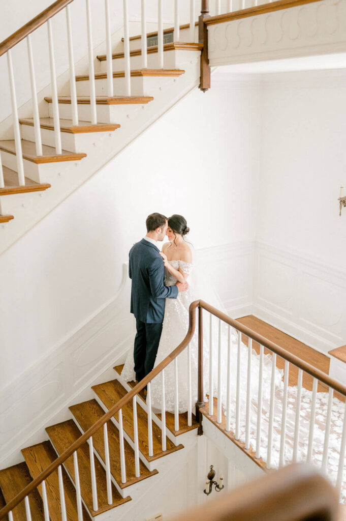 Bride and Groom snuggling on stairs for wedding photography
