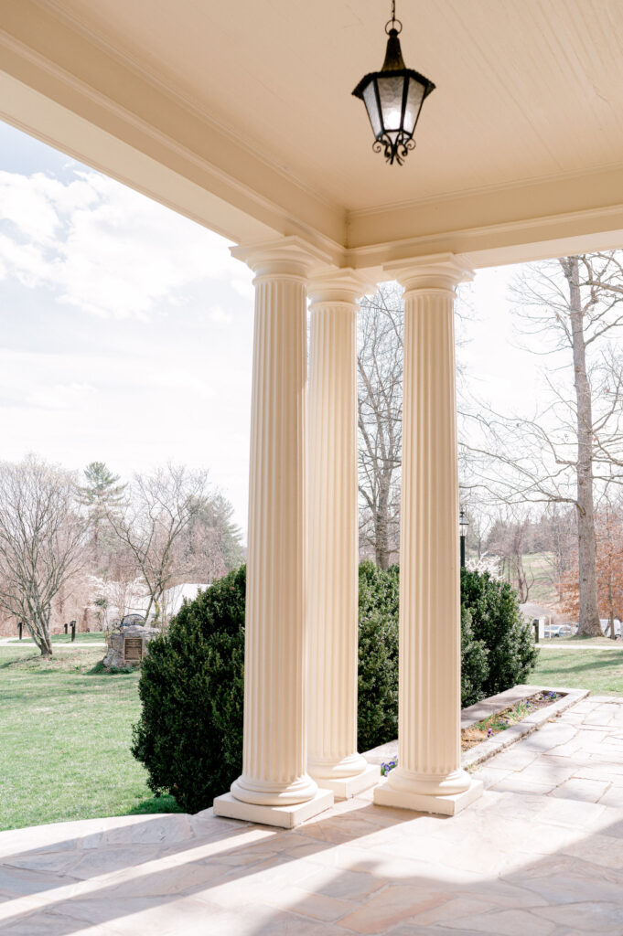 front porch with white columns at Rust Manor House