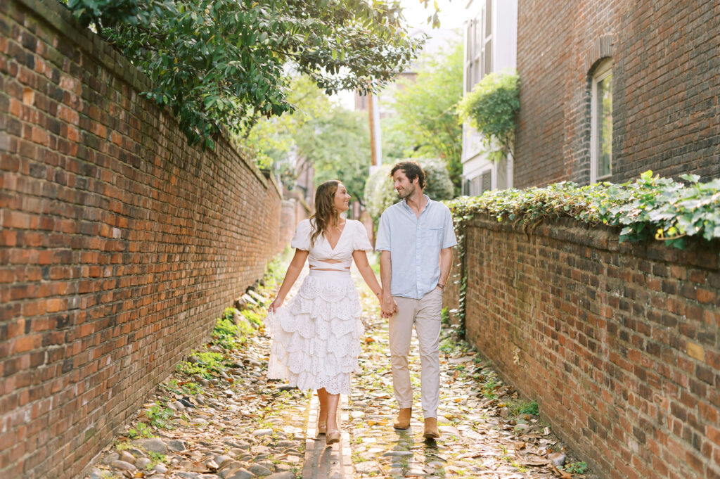 Couple walking in Old Town Alexandria alley
