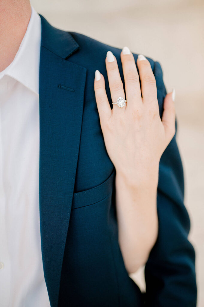 Photo of girl's hand with engagement ring 
