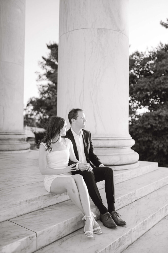 Couple sitting on the steps at the Jefferson Memorial
