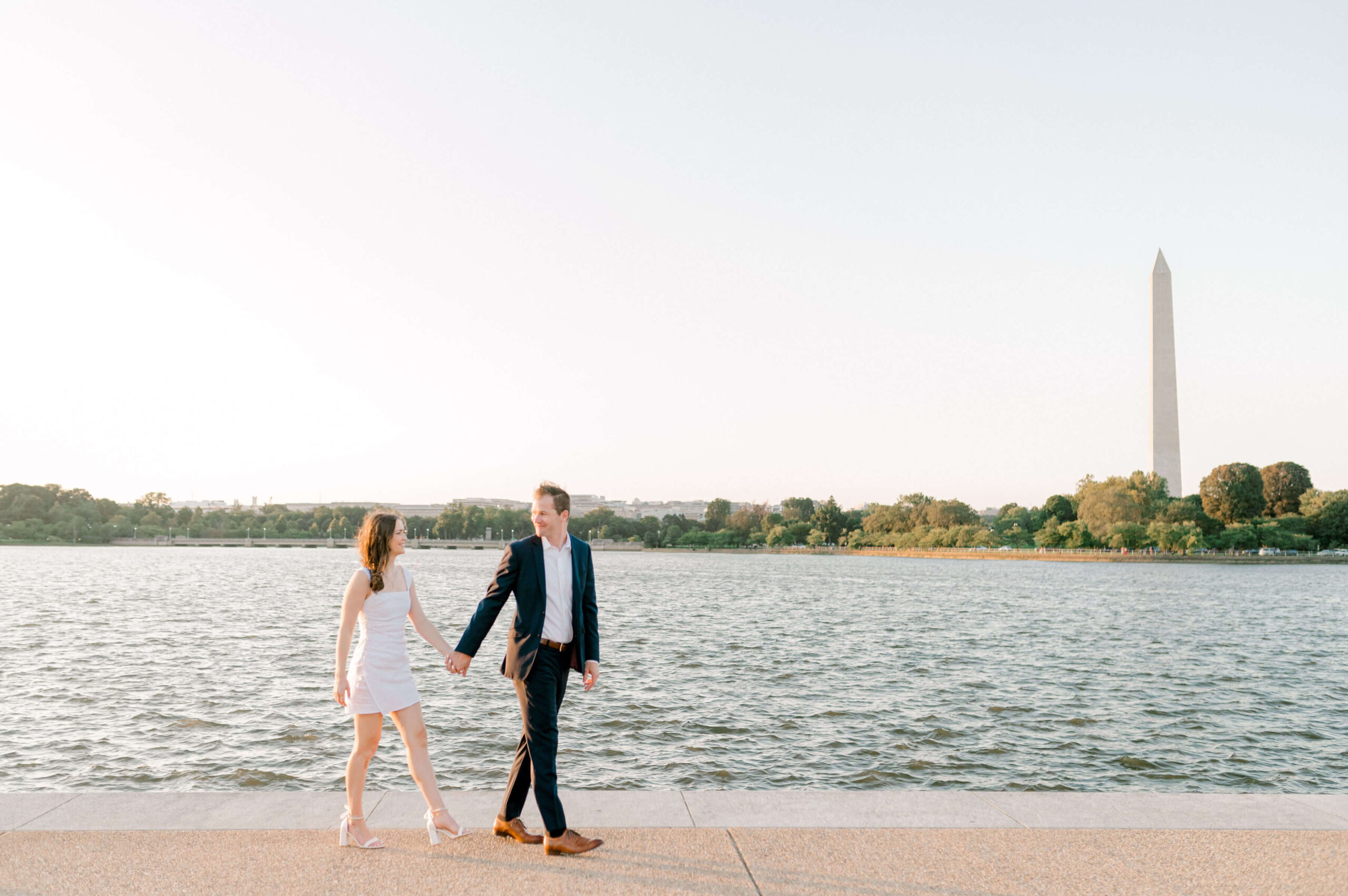 Couple walking in front of Tidal Basin during DC Engagement Photos