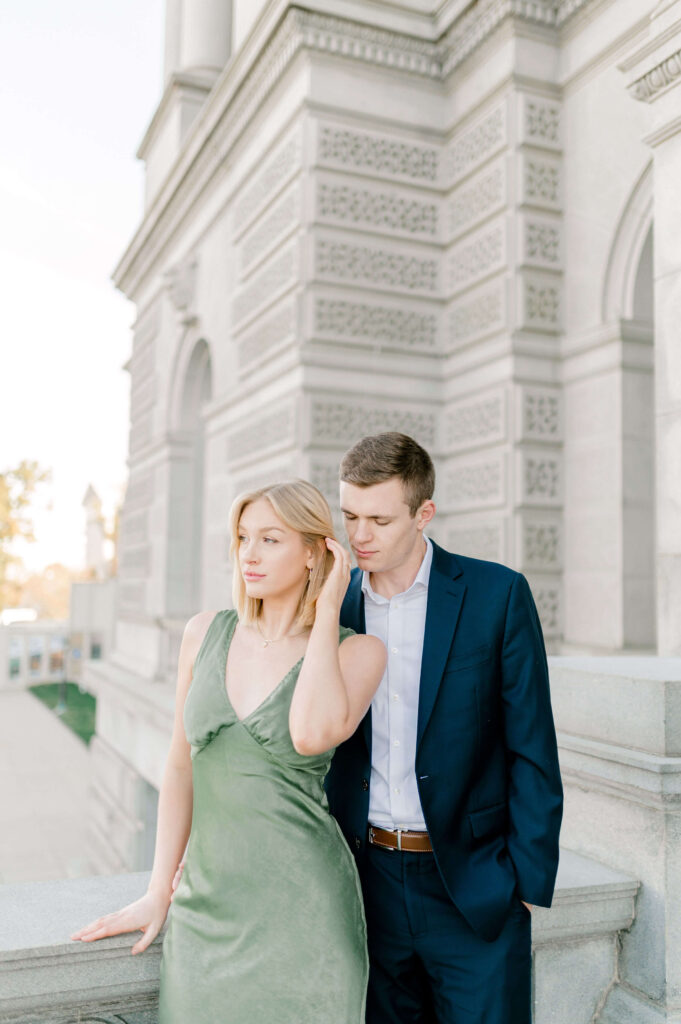 Chic couple wearing green dress and suite at the Library of Congress
