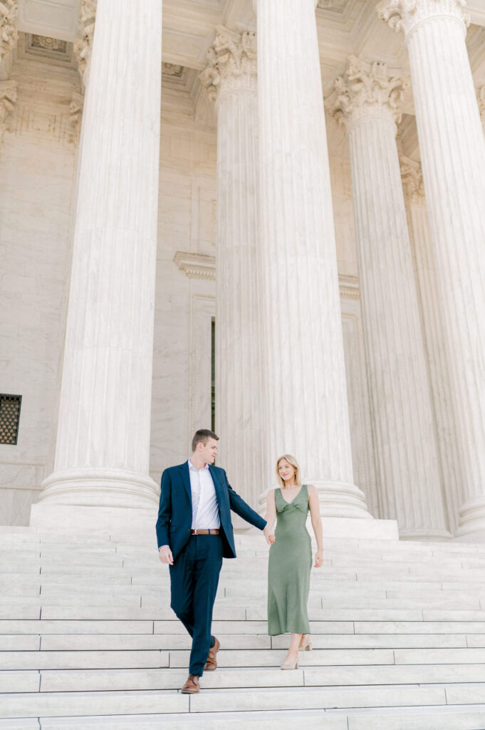 Couple walking down the steps of the Supreme Court during their DC Engagement Photos