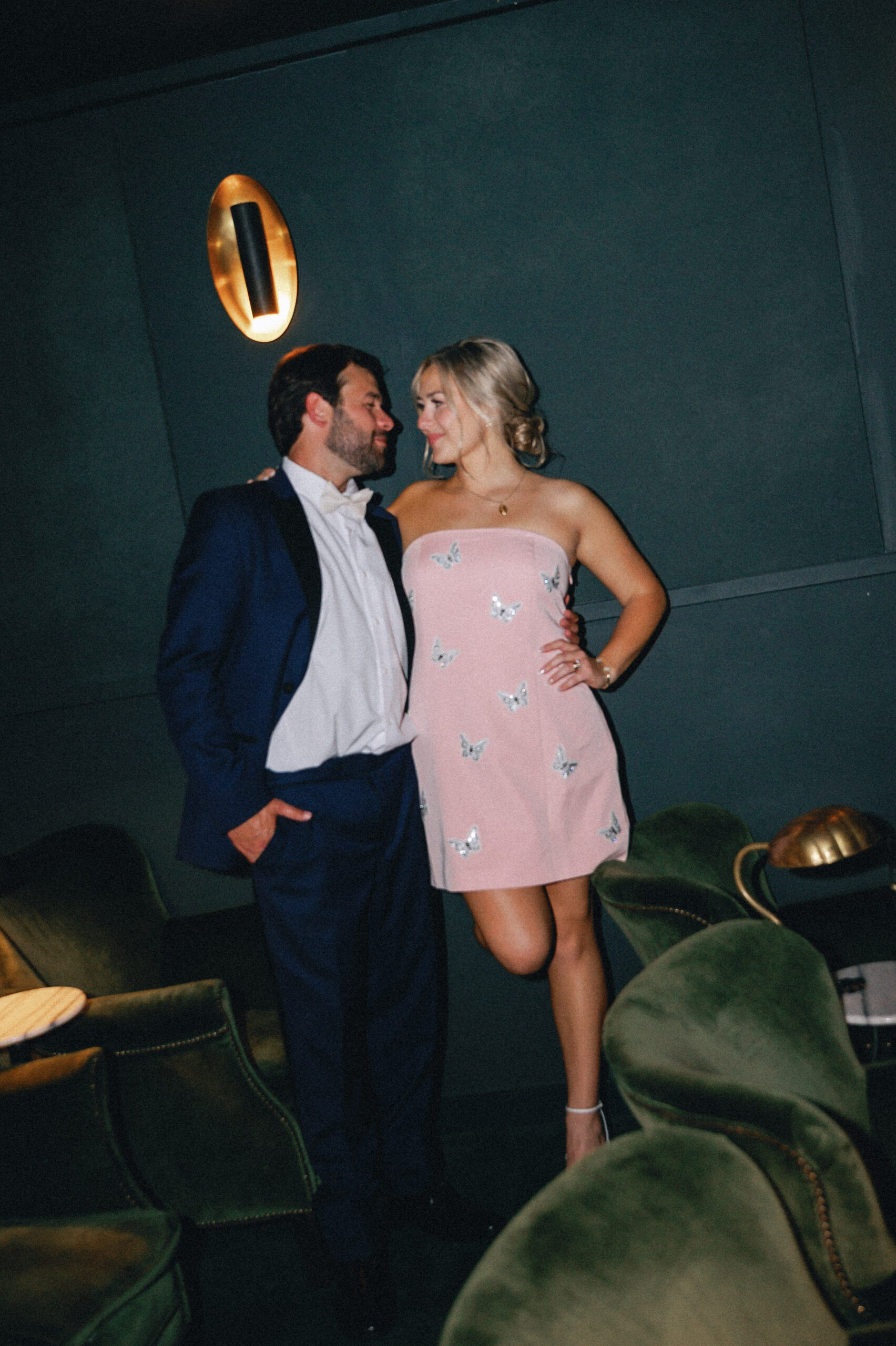 Flash image of a couple in their reception outfits in the Common House RVA Theater