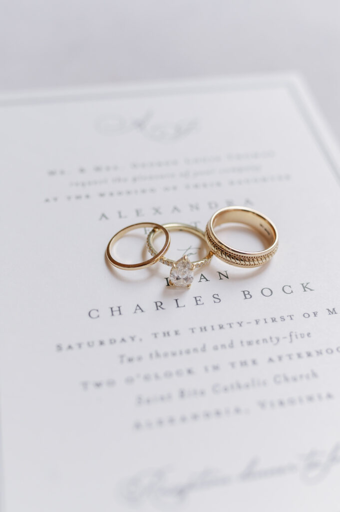 wedding rings on an invitation suite